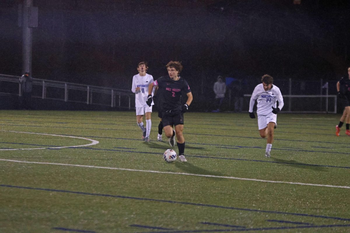 Senior Landon Vincent takes the ball down the field against Olathe Northwest, working to create a scoring opportunity. 