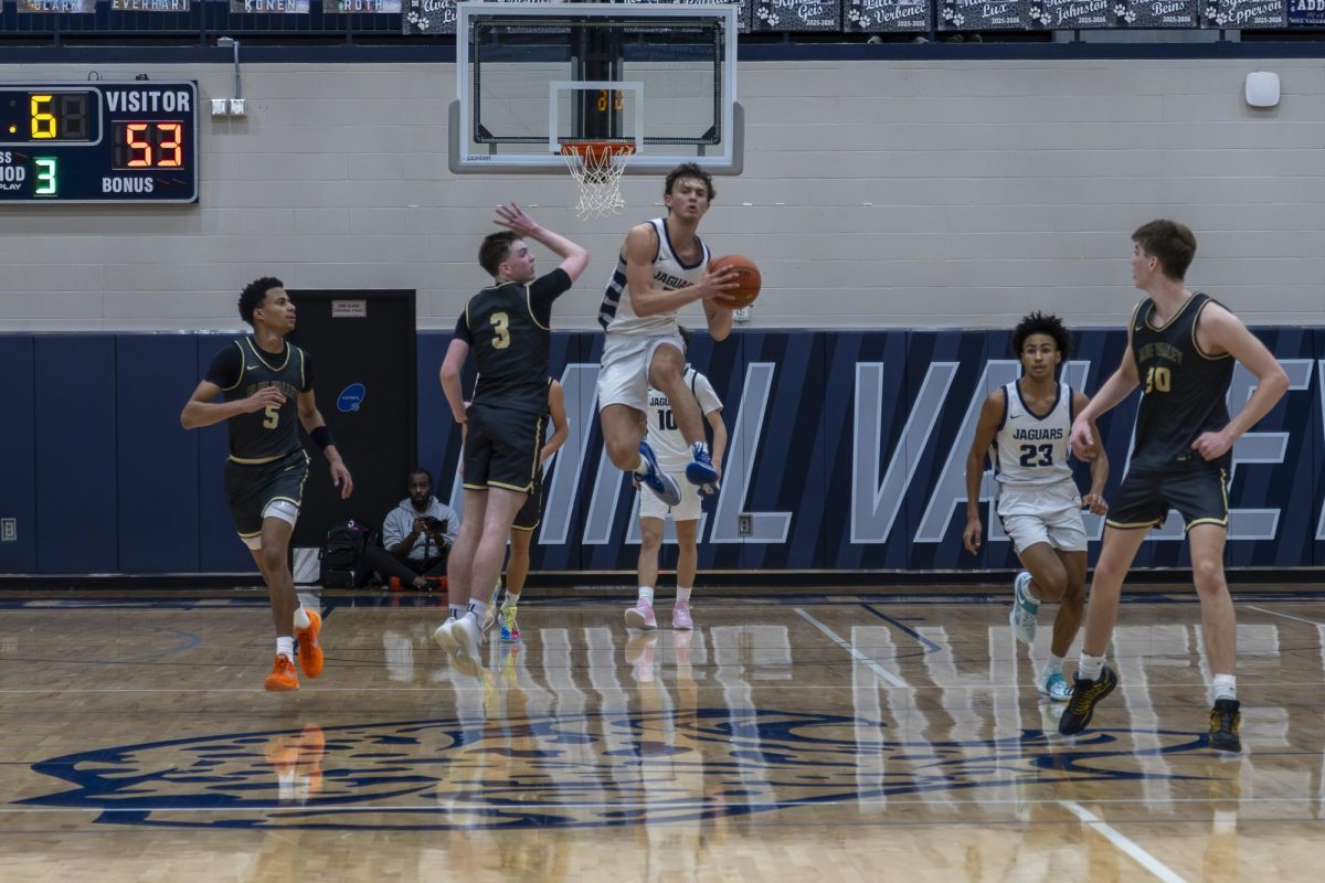 Senior Reece Reidel jumps to make a long shot