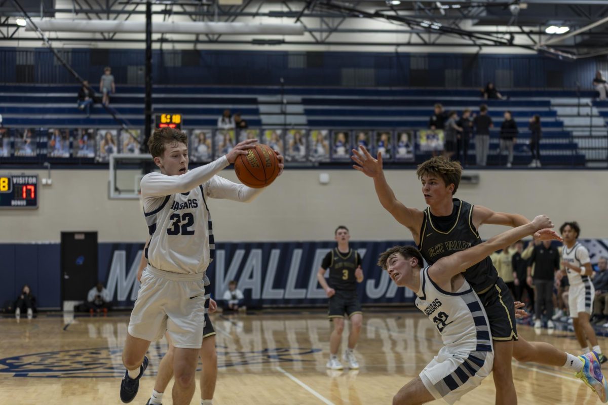 Senior Carter Clark dives to keep a ball in bounds to keep possession. 