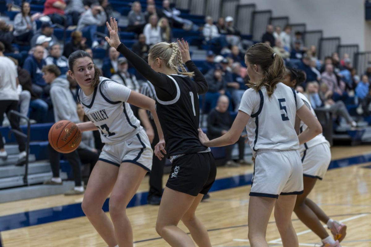 Senior Paige Roth looks for an opening to pass the ball