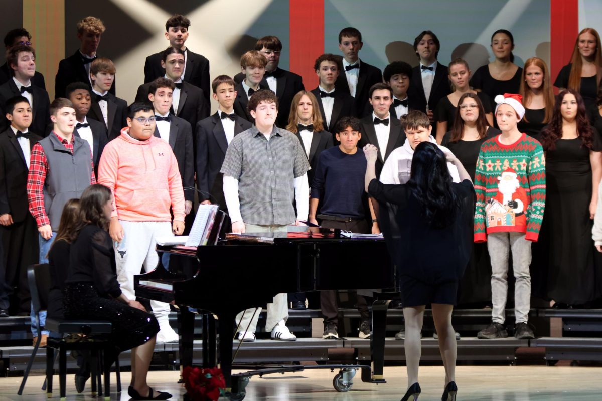 Keeping a tradition alive, alumni James Hassie, Daniel Voka, Blake Gray, and Yazid Vazquez join the choir for their opening song. 