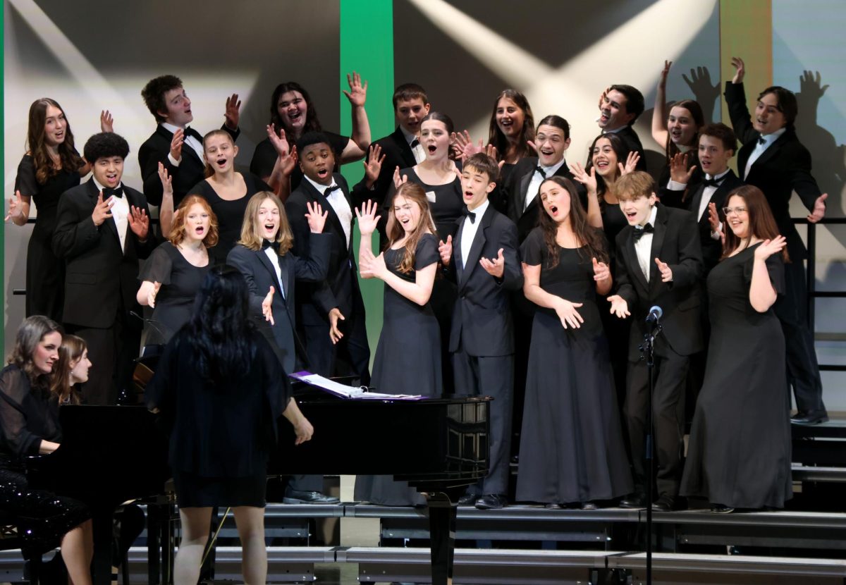 Finishing the last song of the concert the jag singers awaits applause, Thursday, Dec. 11. 