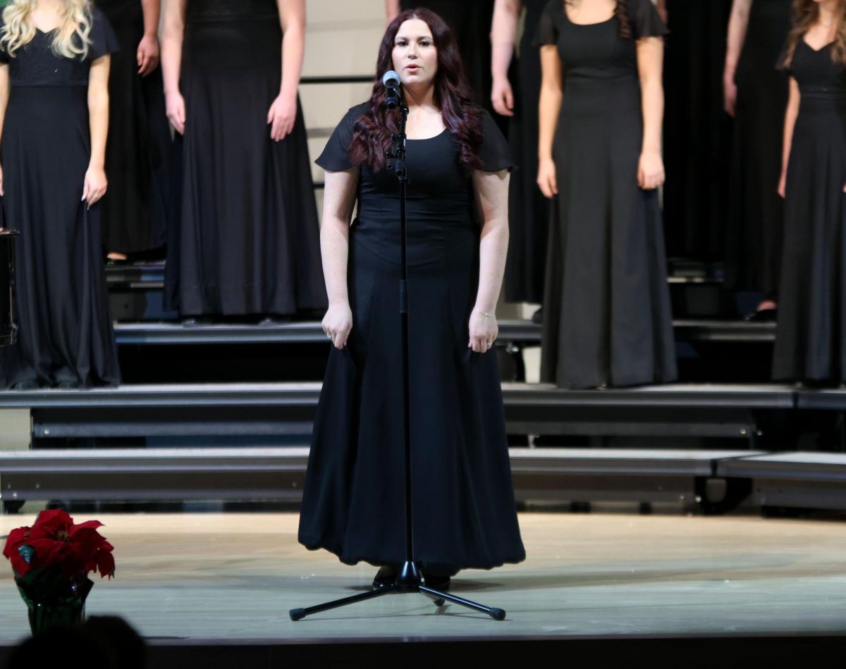 Senior Lily Mott gives her solo in "Where Are You Christmas." 