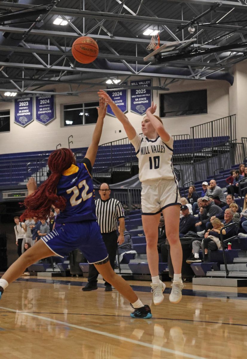Shooting for three, senior Leah Konen, scores for the Jags.