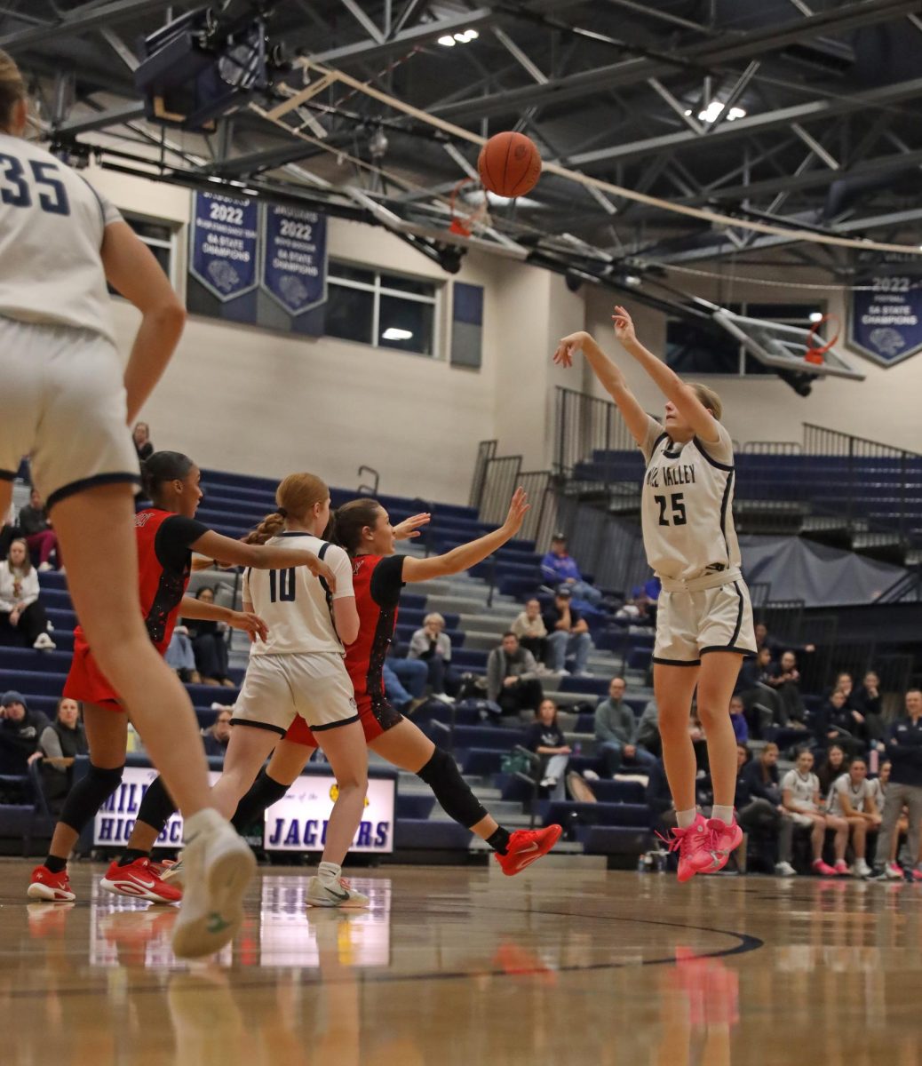 Behind the arch, junior Riley Marshall scores for the Jags.