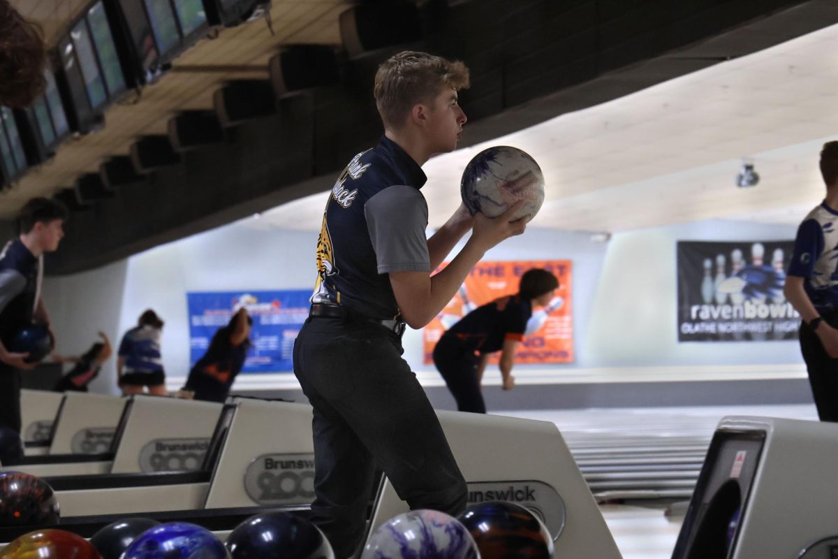 Looking ahead, freshman Frank Hausback gets ready to roll the ball. 