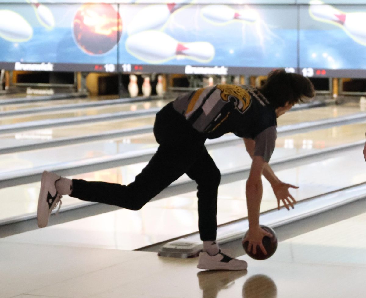Senior Jake Brown release the ball as he bowls his second round. 