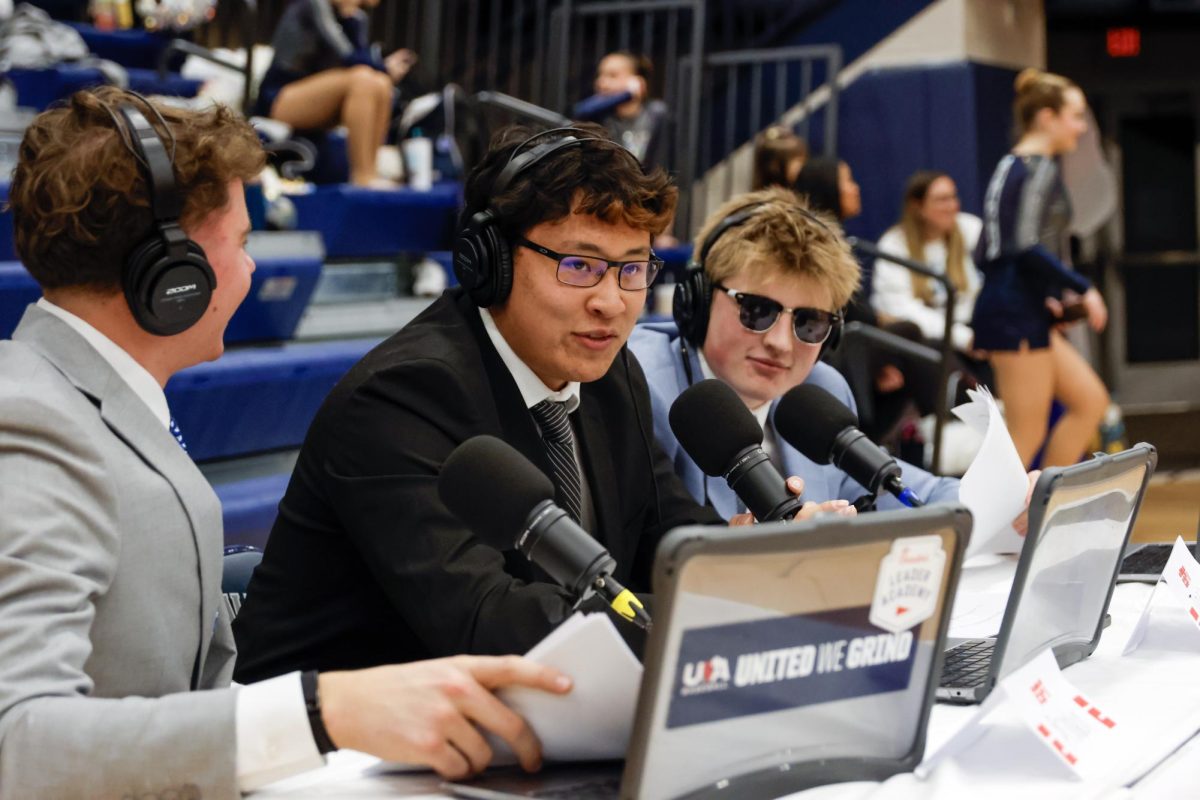 Junior Josh Garcia and seniors Brandon Neis and Elliot Fisher commentate on the game for the HUDL live broadcast