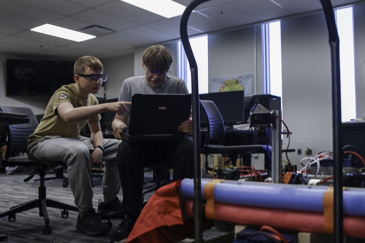 Freshmen Grant Tuttle and Will Edwards work on programming the robot in the programming lab, Saturday Feb 28. photo by evan leroy