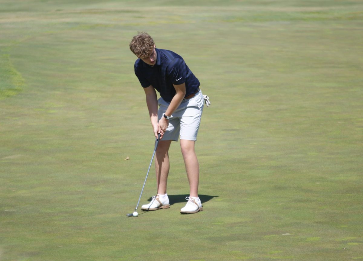 Senior Cannon Fields makes his putt.