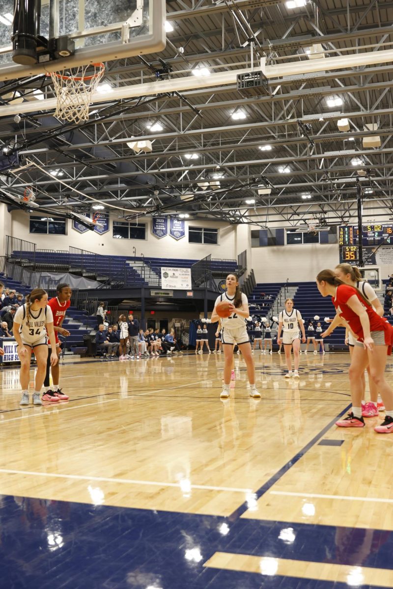 Eyes on the basket, senior Paige Roth shoots a free throw.