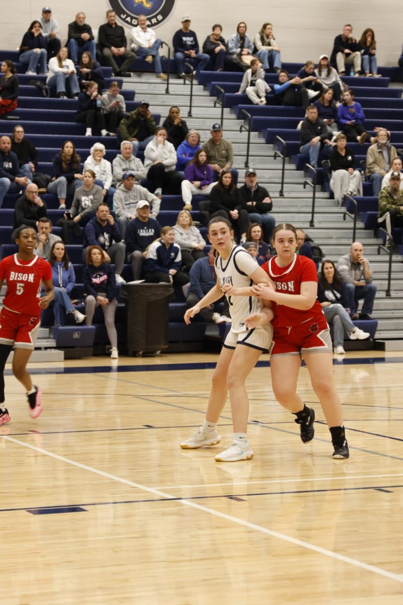 Blocking off the defender, senior Paige Roth boxes out her defender to get the layup.