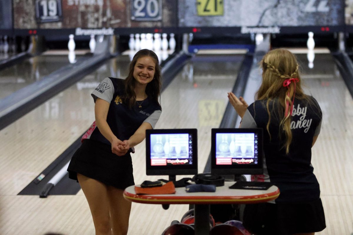 Bowling four strikes in a row senior Layla Gonzales celebrates with her team