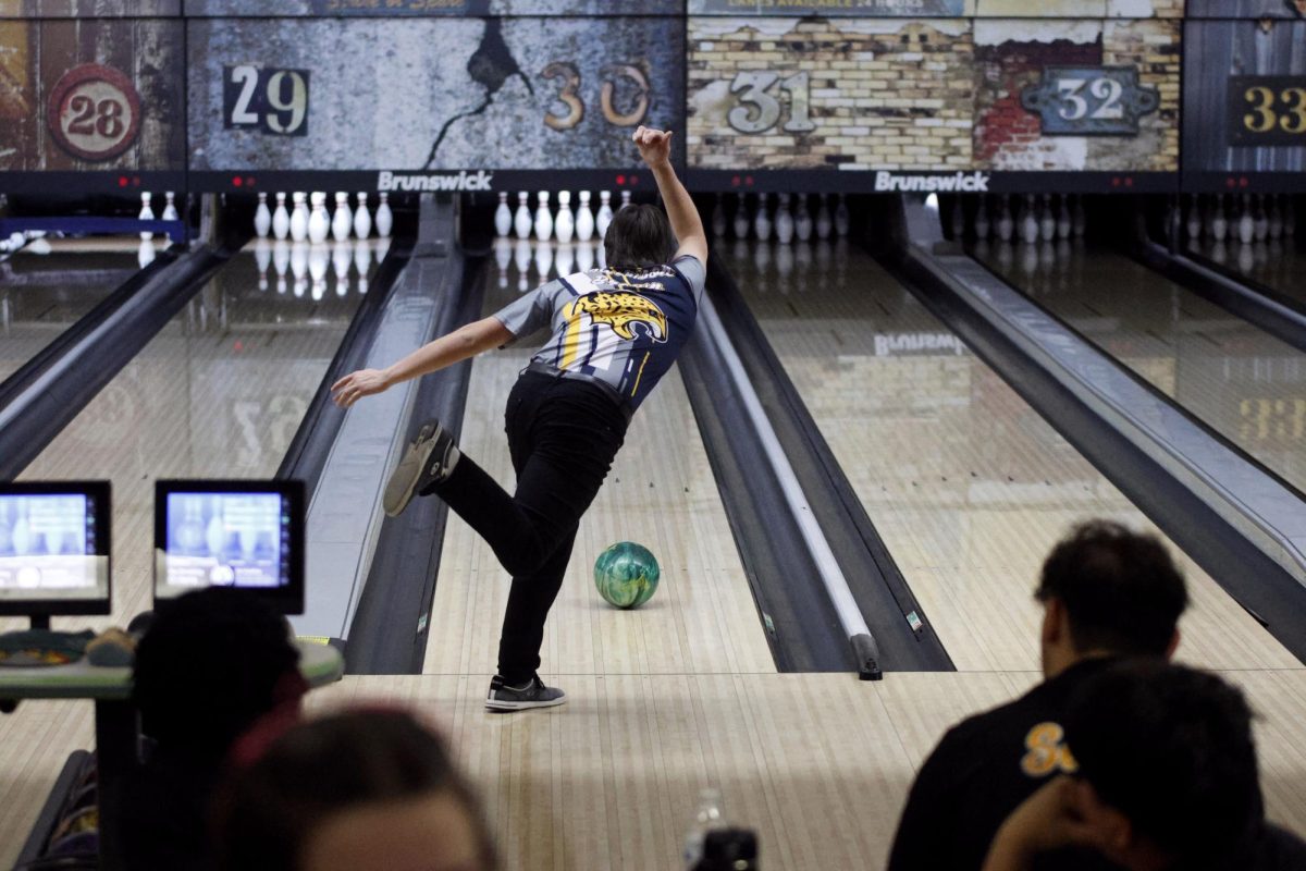 Focused on the lane, senior Harrison Brown prepares to deliver a strike. 