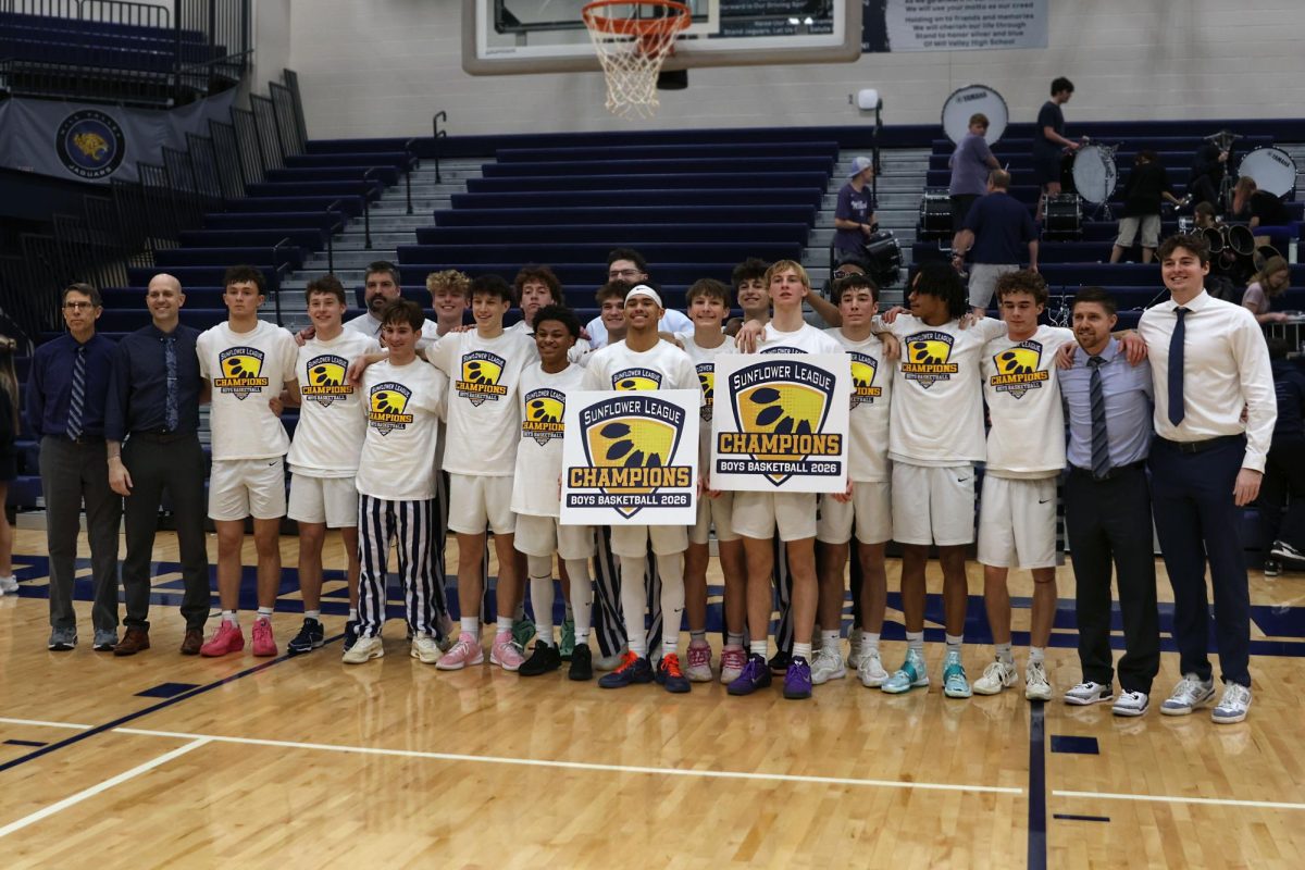 Smiling, the team poses as Sunflower League Champions. 