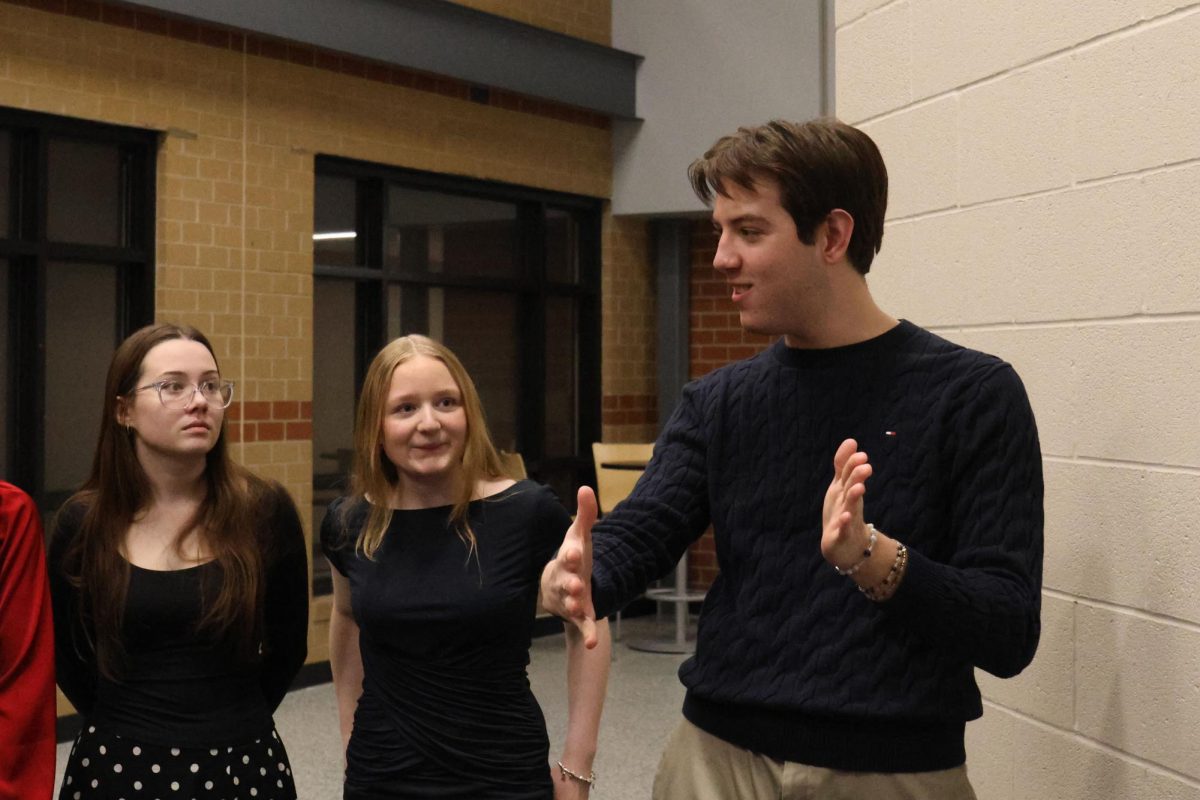 Senior French NHS member Barron Fox explains to current members how the ceremony will be organized, Tuesday, Feb. 24. 