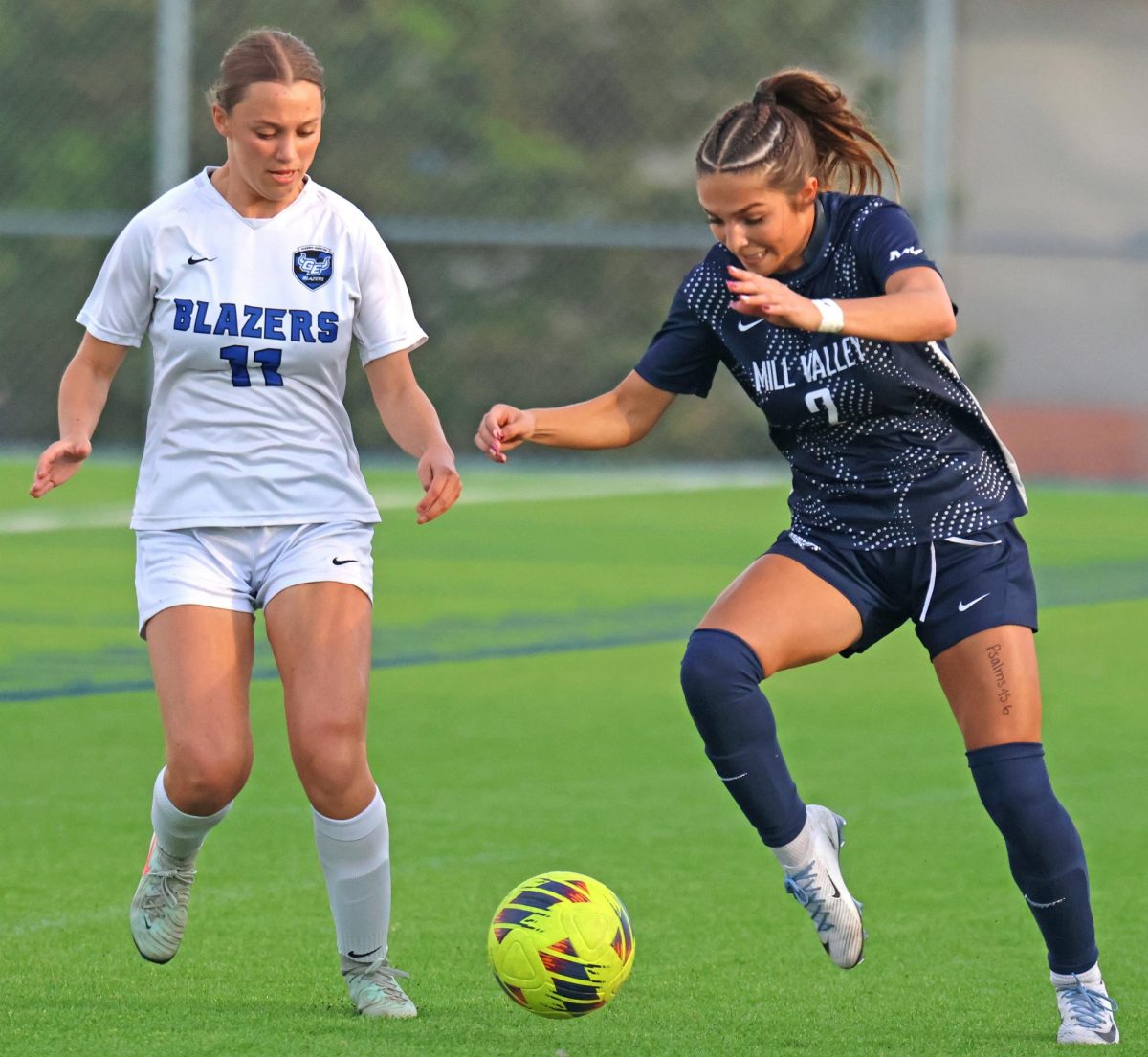 On the attack, junior Paige Frost beats the defender for a run up the field. 