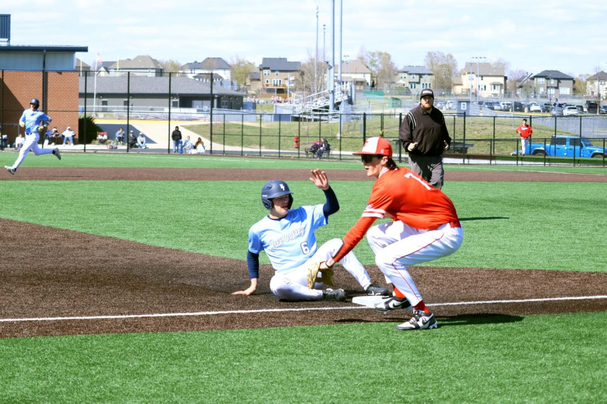 Junior Devin Leiker successfully slides into third base after stealing. 