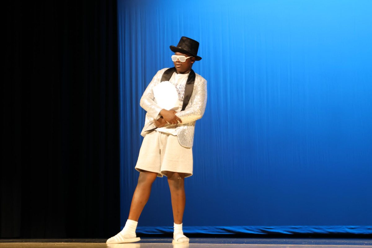 Sophomore Lacina Coulibaly poses as he enters the stage for the first time.