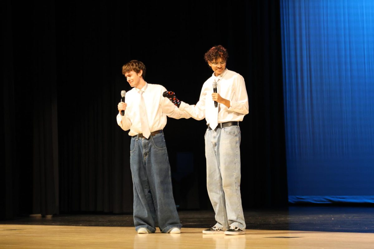 Seniors Nate Petrowsky and Ellyott Edwards emotionally sing “Man or Muppet.” 