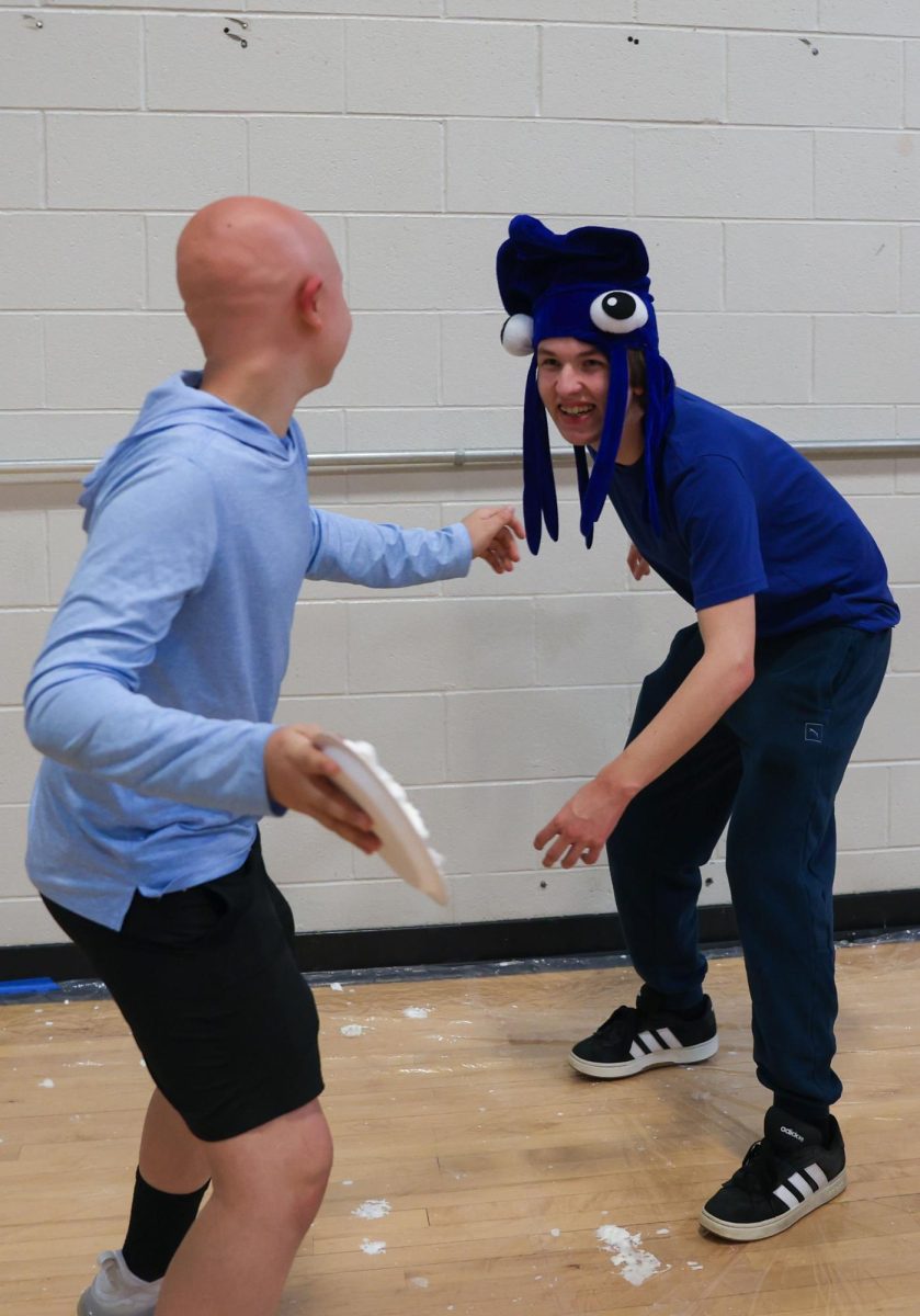 Stepping backward, sophomore Landon Pippitt prepares to get pied in the face.