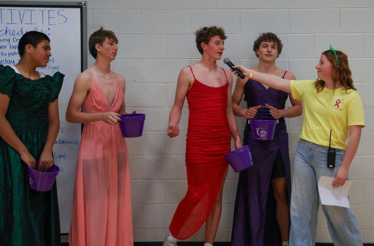 Junior Hadley Doyle interviews Mr. Relay contestants, freshman Alberto Anaya, sophomore Cohen Dick, junior Blayne Vincent and senior Landon Vincent on why they deserve to win the competition to raise the most money.