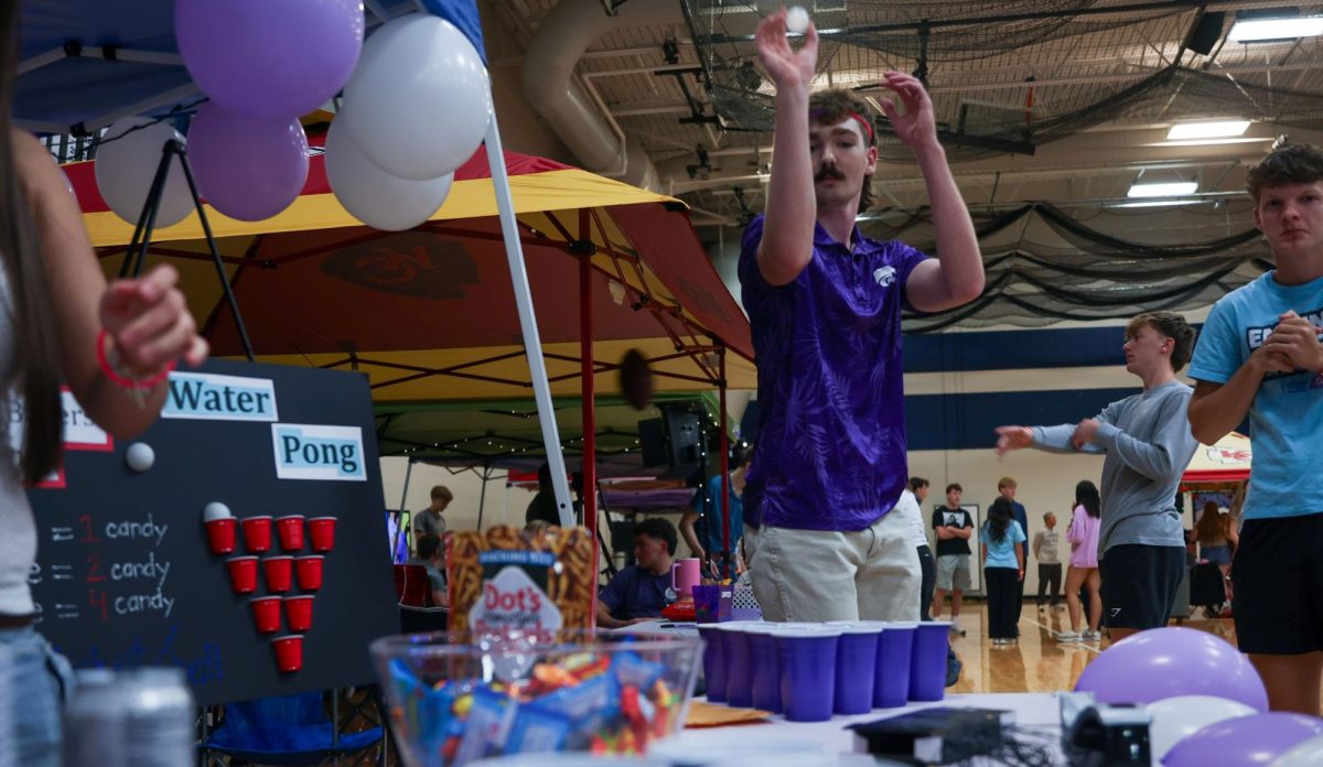 Aiming, senior Gabe Sommerfeld prepares to shoot a ball in a game of water pong.