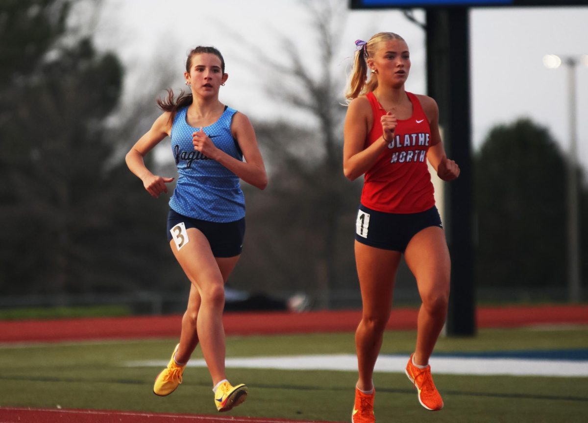 Catching up to her opponent, freshman Kaitlyn Pringle runs the last 100m of the race.