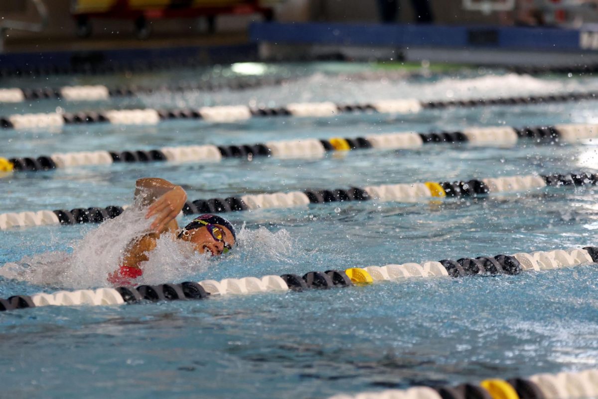 Junior Abby Stidham-Ebberts securing a top placement for the team during the freestyle event. 