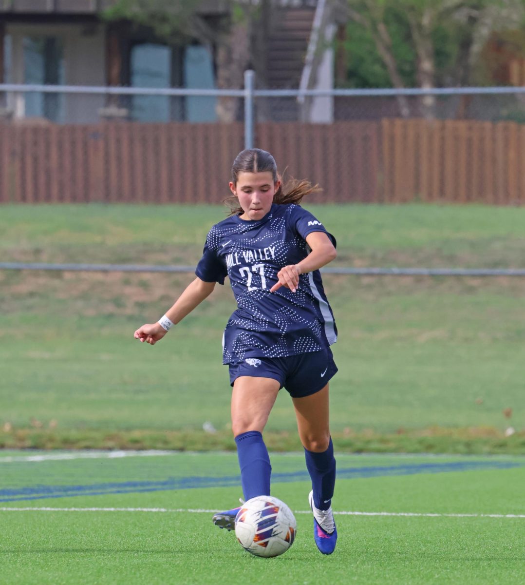 Playing her teammate, junior Lannah Esquibel gets the ball up the field.
