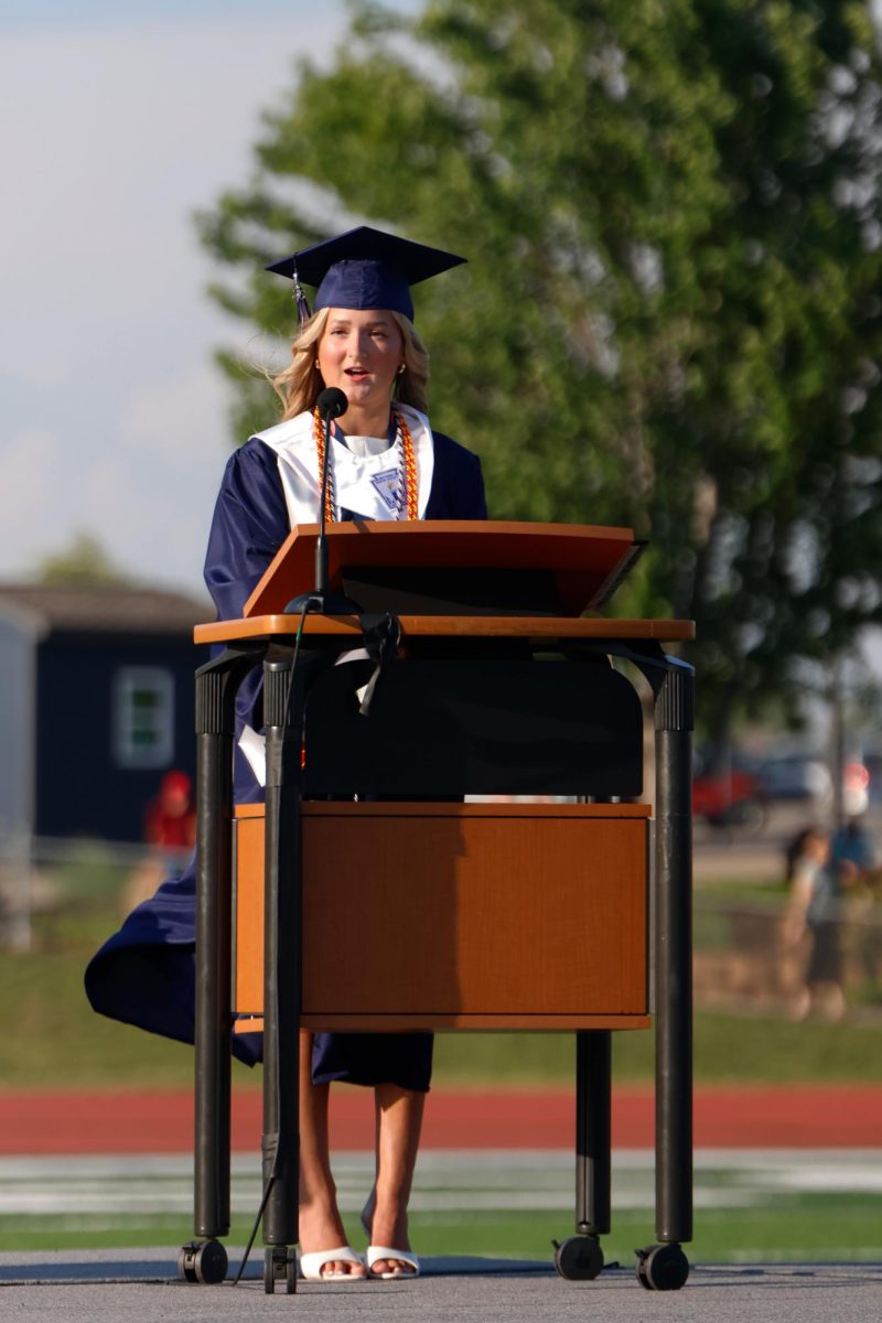 Looking into the audience, senior Mallory Lux gives her class president speech.