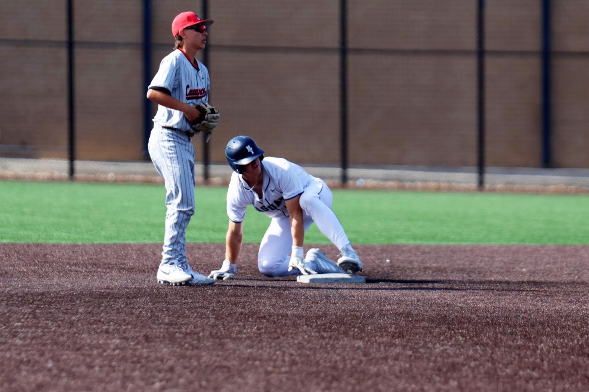 Senior Beau Peterson slides into second base after stealing 
