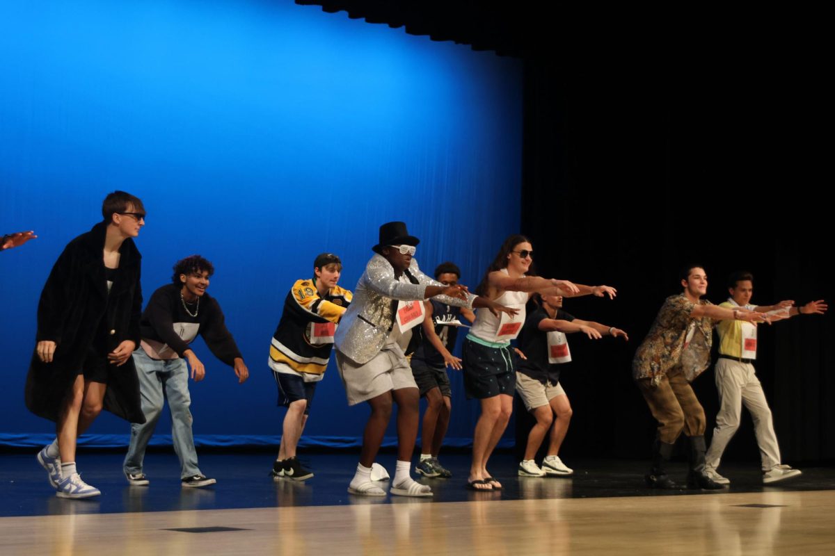The candidates of Mr. Mill Valley perform a choreographed dance sequence for the opening ceremony, Wednesday, April 22. 