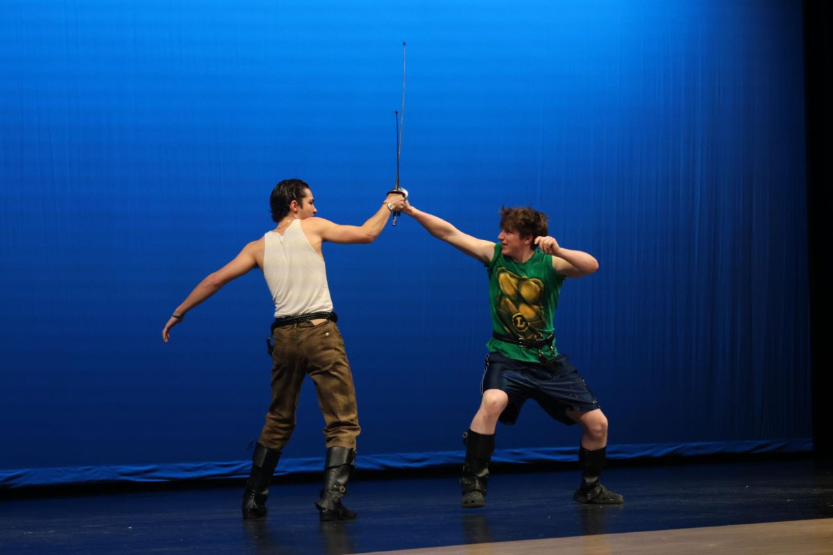 Senior Pete Williams and Sophomore Jack Musil sword fight in a pretend duel for the talent portion of Mr. Mill Valley.